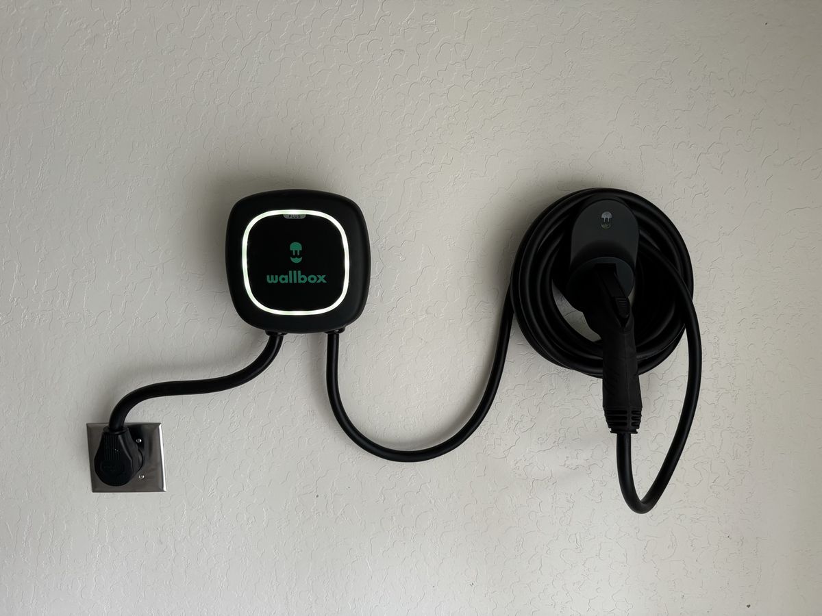 Wallbox EV charger installed on a garage wall